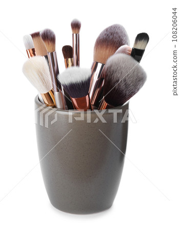 Set of professional makeup brushes in holder isolated on white 108206044