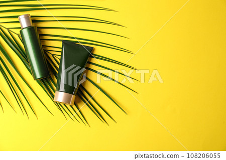 Cosmetic products on yellow background, flat lay. Space for text 108206055