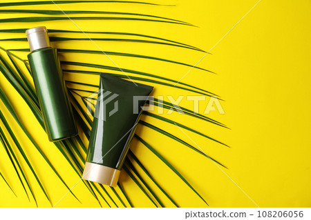 Cosmetic products on yellow background, flat lay. Space for text Cosmetic products on yellow background, flat lay. Space for text 108206056