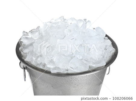 Full metal bucket with ice cubes and pieces of crushed ice isolated on  white background. Stock Photo