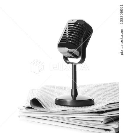 Newspapers and vintage microphone isolated on white. Journalist's work 108206091