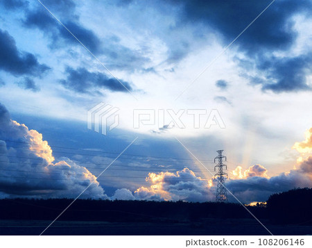 Silhouette of high voltage post and High-voltage tower Electric Transportation against in the evening and cloud at sunset.  108206146