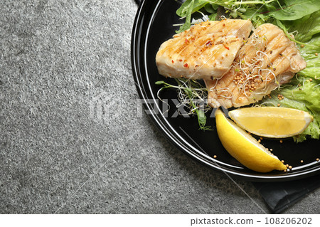 Tasty grilled fish on grey table, top view 108206202