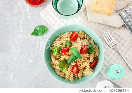 Flat lay composition with tasty pasta on light grey marble table Flat lay composition with tasty pasta on light grey marble table 108206264