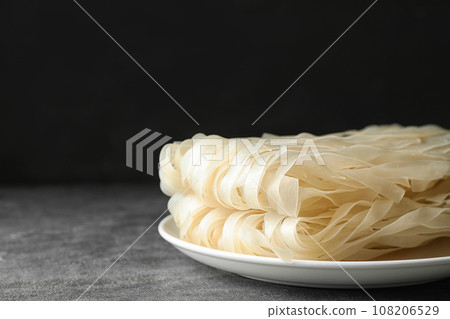 Block of rice noodles on grey table 108206529