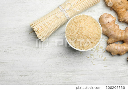 Flat lay composition with rice noodles on white wooden table, space for text Flat lay composition with rice noodles on white wooden table, space for text 108206530