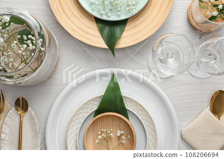 Elegant festive setting on white wooden table, flat lay Elegant festive setting on white wooden table, flat lay 108206694