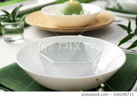 Stylish dishes on table, closeup. Festive setting Stylish dishes on table, closeup. Festive setting 108206713
