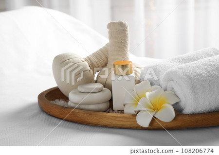 Beautiful composition with spa stones on white fabric, closeup 108206774
