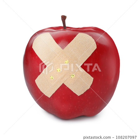 Red ripe apple with sticking plasters isolated on white 108207097