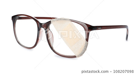 Glasses with sticking plaster isolated on white 108207098