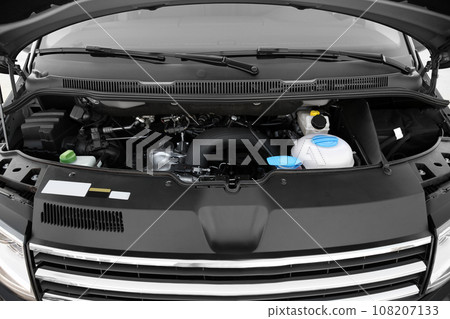 Closeup view of engine bay in modern car Closeup view of engine bay in modern car 108207133