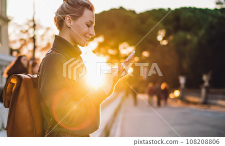 positive woman with mobile device networking positive woman with mobile device networking 108208806