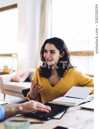 Happy lady talking with man in bright office Happy lady talking with man in bright office 108209264