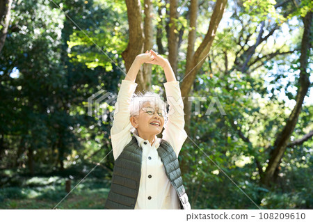 Senior woman taking a deep breath 108209610