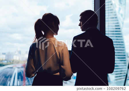 Entrepreneurs standing near window at workplace 108209762