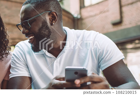 couple in love using 4g wireless internet on smartphone gadgets 108210015