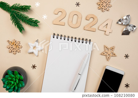 New Year Aims 2024. To Do List. Empty Notebook at the Desk with Holiday Decoration. Top view. Creating Plan, Resolution. New Life, Start Up, Beginning Concept. Business ideas. Goals, action, checklist New Year Aims 2024. To Do List. Empty Notebook at the Desk with Holiday Decoration. Top view. Creating Plan, Resolution. New Life, Start Up, Beginning Concept. Business ideas. Goals, action, checklist 108210080