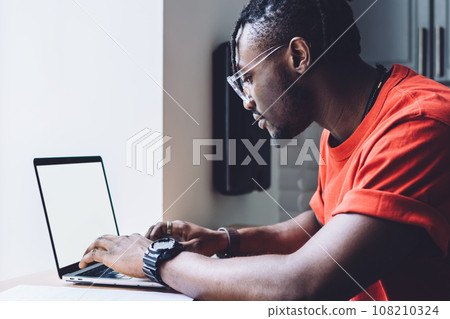 Smart black man working on laptop 108210324