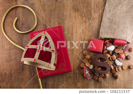 Dutch holiday Sinterklaas background with mitre or mijter staff and book of Sinterklaas. 108211537