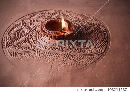 Burning diya on Happy Diwali, background for light festival of India 108211587