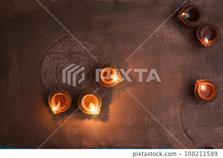 Burning diya on Happy Diwali, background for light festival of India 108211589