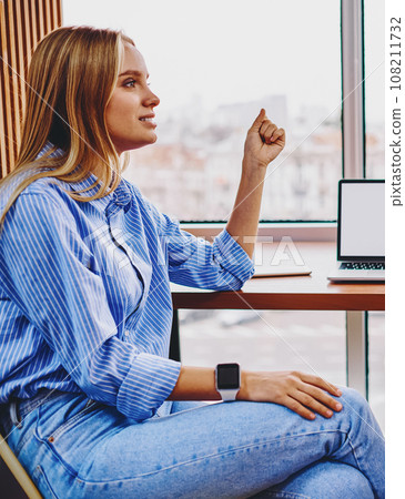 Colleagues communicating with each other between computer with blank screen area Colleagues communicating with each other between computer with blank screen area 108211732