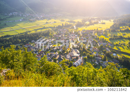 Sunny morning above Mojstrana town in Julian Alps, Slovenia 108211842