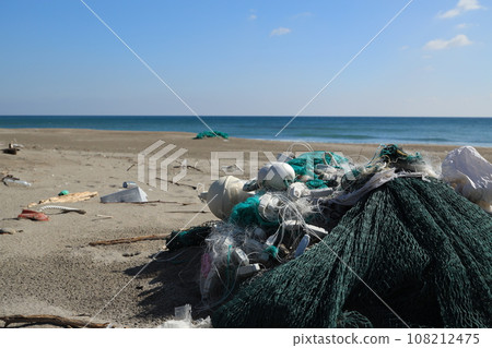 Abandoned fishing gear washed up on the shore 108212475