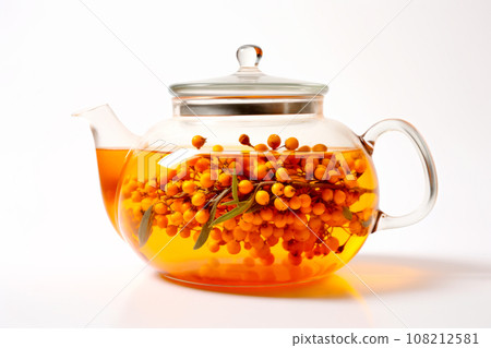 A glass teapot with sea-buckthorn berries, oolong tea in glass kettle isolated on white background. Chinese tea ceremony 108212581