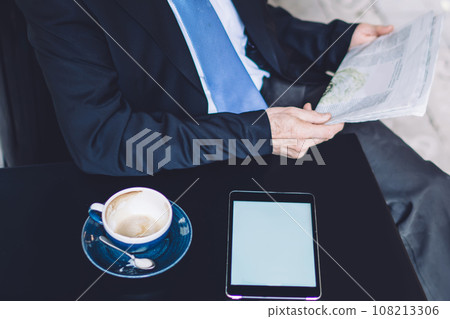 Senior man in glasses with paper in hands Senior man in glasses with paper in hands 108213306