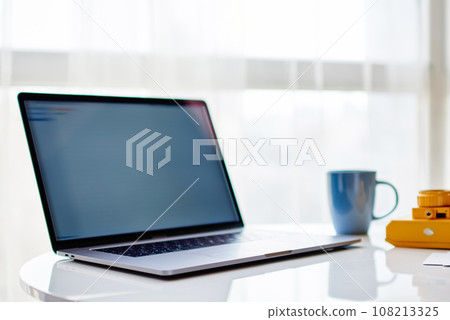 Mock up display of netbook on modern table Mock up display of netbook on modern table 108213325