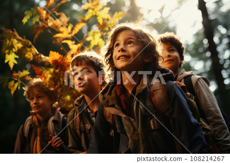 Children of different nationalities enjoy autumn, play, run, laugh and smile in an autumn park with yellow leaves 108214267