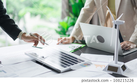 Alternative energy environment businesspeople checking solar cell panel and discuss about document 108215226