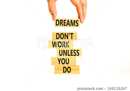 Dream and do symbol. Wooden blocks with words Dreams do not work unless you do. Beautiful white table white background. Businessman hand. Business, motivational dream and do concept. Copy space. Dream and do symbol. Wooden blocks with words Dreams do not work unless you do. Beautiful white table white background. Businessman hand. Business, motivational dream and do concept. Copy space. 108218267