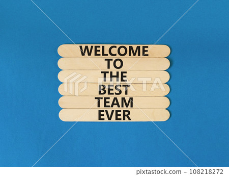 Welcome to best team symbol. Concept words Welcome to the best team ever on wooden stick on beautiful blue table blue background. Business, motivational and welcome to best team concept. 108218272