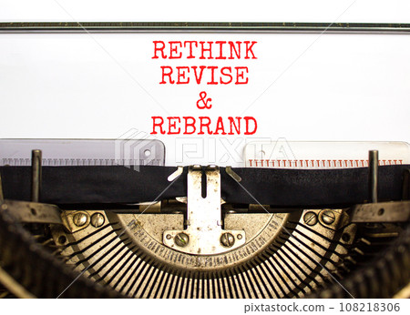 Rethink revise rebrand symbol. Concept word Rethink Revise and Rebrand typed on typewriter. Beautiful white paper background. Business brand motivational rethink revise rebrand concept. Copy space 108218306