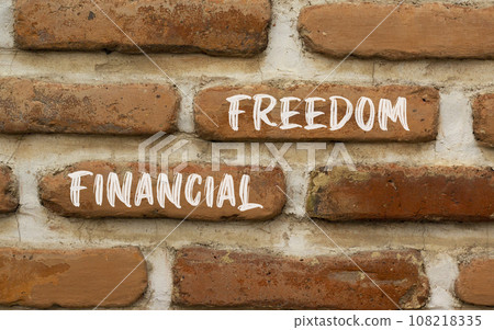 Financial freedom symbol. Concept words Financial freedom on beautiful brick wall. Beautiful red brown brick wall background. Business financial freedom concept. Copy space. Financial freedom symbol. Concept words Financial freedom on beautiful brick wall. Beautiful red brown brick wall background. Business financial freedom concept. Copy space. 108218335