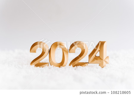 Greeting card - happy new year with numbers 2024 in artificial snow on white background Greeting card - happy new year with numbers 2024 in artificial snow on white background 108218605
