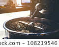 Close-up of coffee beans in roaster 108219546