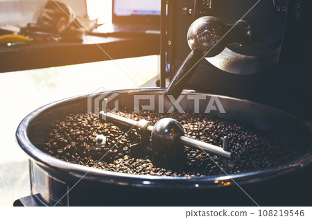 Close-up of coffee beans in roaster Close-up of coffee beans in roaster 108219546