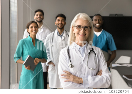 Happy elder mature head doctor woman posing with arms crossed 108220704
