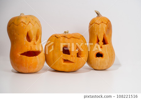 Three jack-o-lantern on a white background. Halloween decoration. 108221516