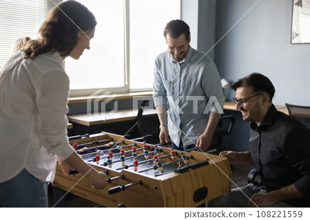 Happy joyful teammates, friendly colleagues having fun in office Happy joyful teammates, friendly colleagues having fun in office 108221559