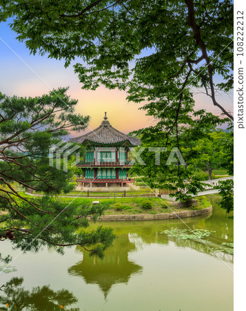 Sunset at the Hyangwonjeong Pavilion in the center of the pond in the Gyeongbokgung palace 108222212