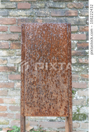 rusty blank panel over old brick wall rusty blank panel over old brick wall 108222432