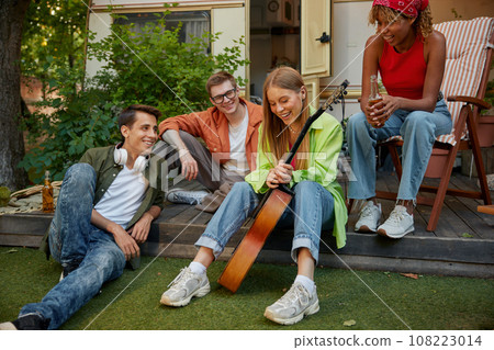 Summer party camping of diverse friends group with guitar music Summer party camping of diverse friends group with guitar music 108223014