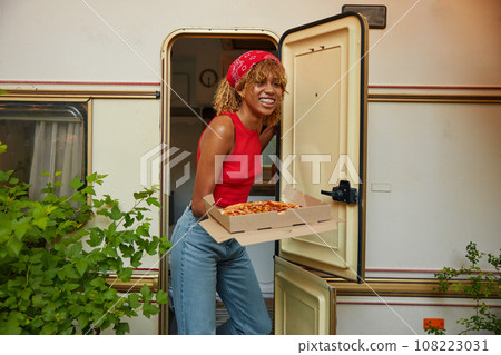 Young girl serving table with pizza 108223031