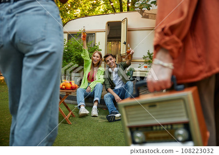 Happy young people enjoying in picnic during summer, meeting of friends 108223032