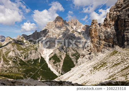 Untrodden places near peaks in Dolomites. Bright sunny day in high mountains. Untrodden places near peaks in Dolomites. Bright sunny day in high mountains. 108223318